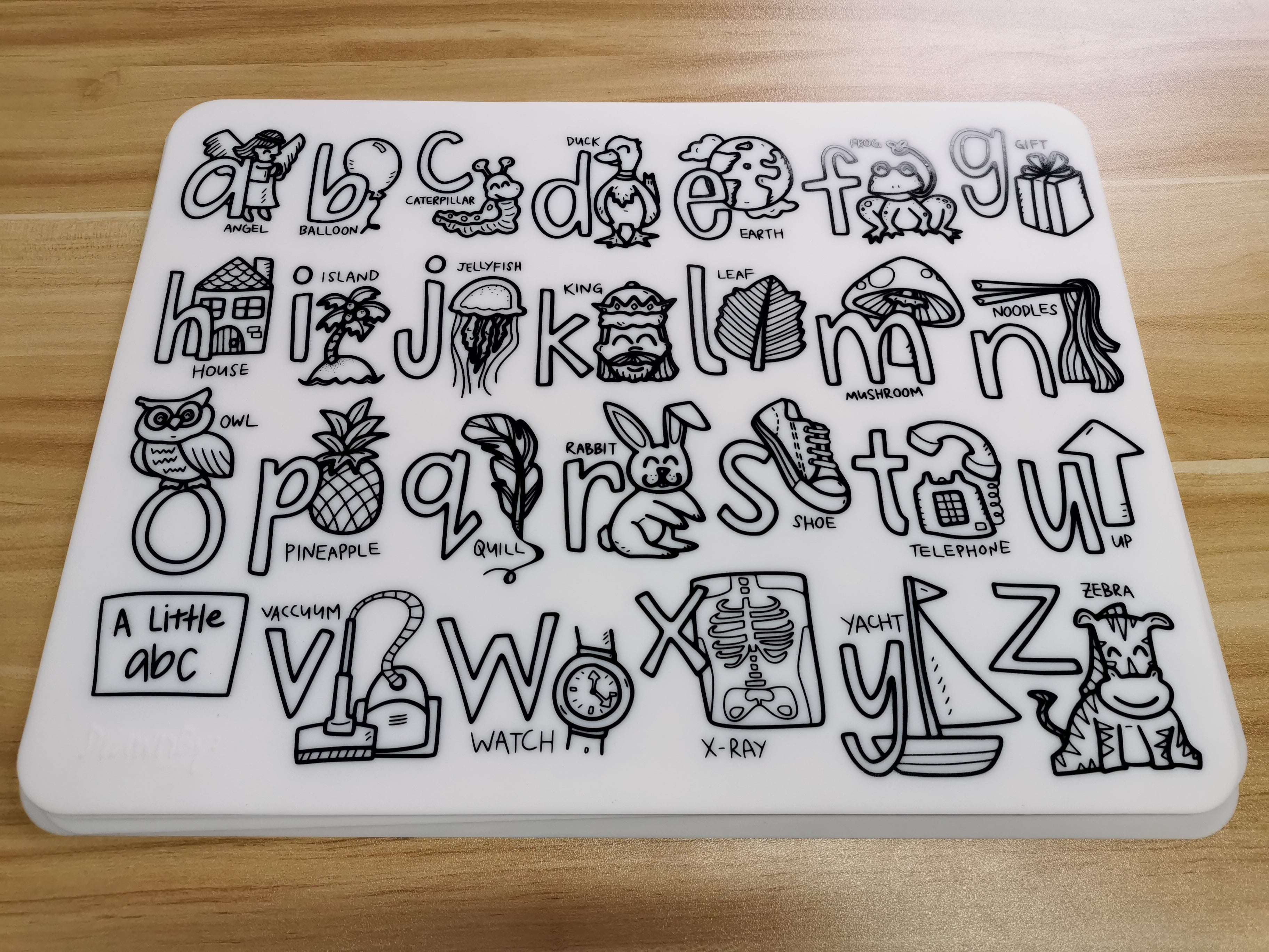 Alphabet and numbers stamp set on a wooden surface